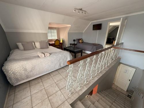 Ένα ή περισσότερα κρεβάτια σε δωμάτιο στο Aqua View Riverside Guesthouse