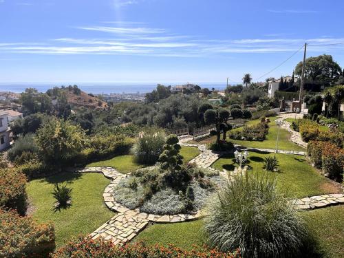 an aerial view of a garden with a pathway at Villa Puerto de la Luz in Mijas
