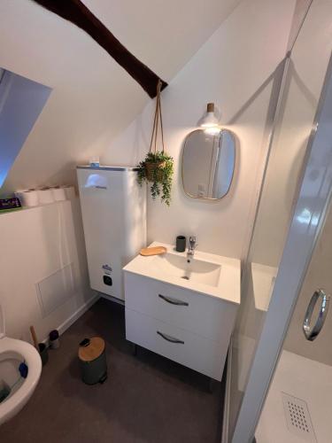 a bathroom with a sink and a toilet at Centre Nemours - Climatisation - Cosy Deluxe in Nemours