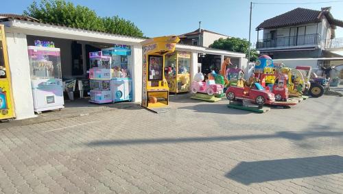 a group of childrens toys in a parking lot at SiviriLovelyApartment in Siviri