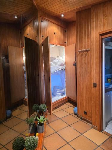 a kitchen with an open door to a refrigerator at Can Marisu in Cabrils