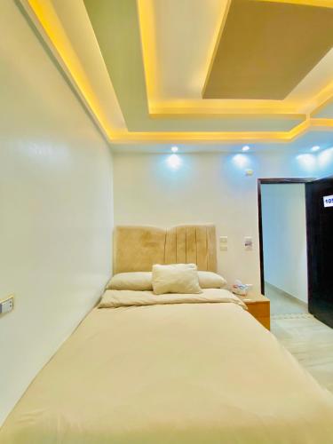 Ένα ή περισσότερα κρεβάτια σε δωμάτιο στο Pyramids Gardens Boutique Hotel New pyramids Gate