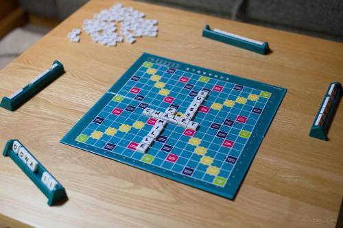 a wooden table with a board game on it at Les Mayens in Leysin