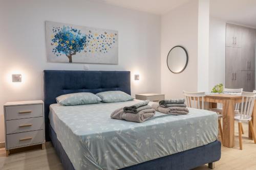 Postel nebo postele na pokoji v ubytování Myrina Retreat - Blue Horizon