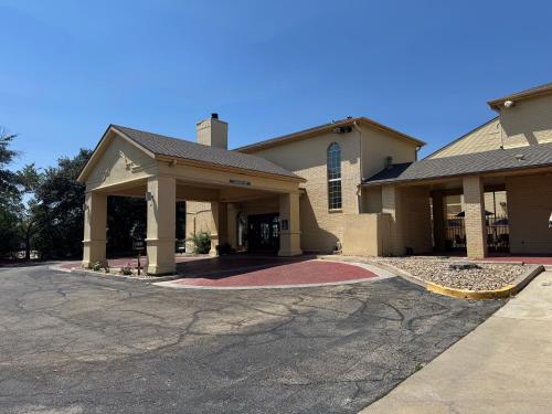 a church with a driveway in front of it at Days Inn by Wyndham Georgetown in Georgetown