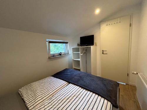 Postel nebo postele na pokoji v ubytování Ferienwohnung Eiderblick
