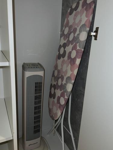 a chair next to a radiator in a room at Apartmán Mičinská in Banská Bystrica