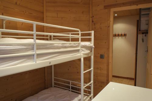 a bunk bed room with two bunk beds in a cabin at Les Flocons in Les Gets