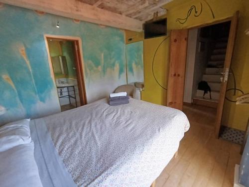a bedroom with a white bed in a room at Habitación Doble Cian Baño Privado Cartes in Cartes