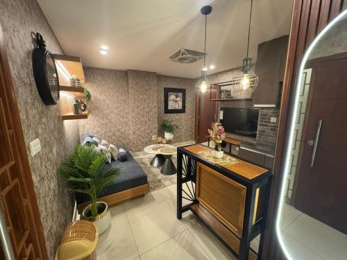 a living room with a couch and a table at Kazani Heights Luxurious apartments in Islamabad
