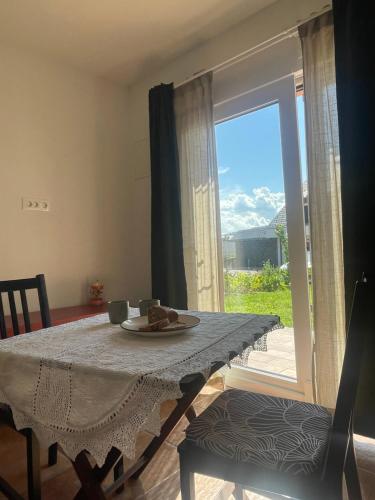 a dining room table with a plate of food on it at Vila Malina in Gaberje