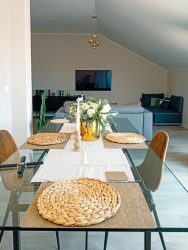 a dining room with a glass table with chairs at Bellavista Deluxe in Cesena