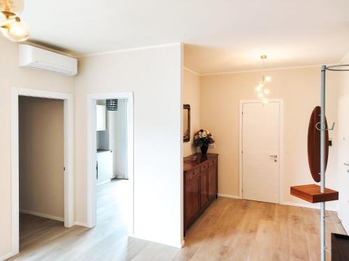 an empty living room with a door and a hallway at Bellavista Deluxe in Cesena