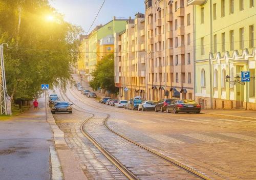 a city street with cars parked on the street at Senate Hotel in Helsinki