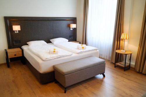 Cama o camas de una habitación en Hotel Sonne