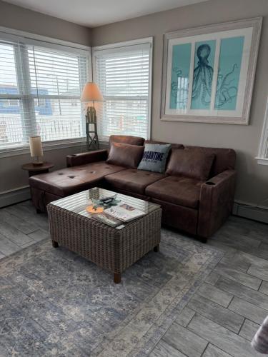 a living room with a couch and a coffee table at 33rd Unit 2 Island Time Parking Beach 2 Blocks Away in Brigantine