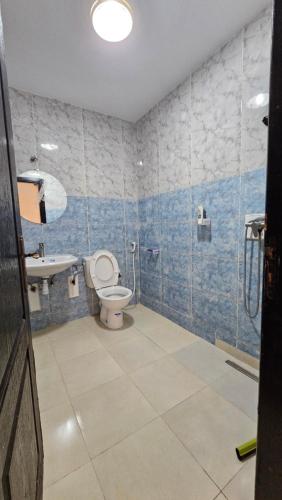 a bathroom with a toilet and a sink at Jad Appartement N1 in Essaouira