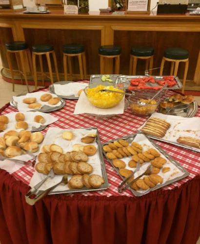a table with a red table cloth with food on it at Hotel Balbi Resort in Mendoza
