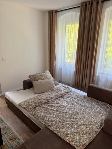 Ένα ή περισσότερα κρεβάτια σε δωμάτιο στο Panorama Apartments