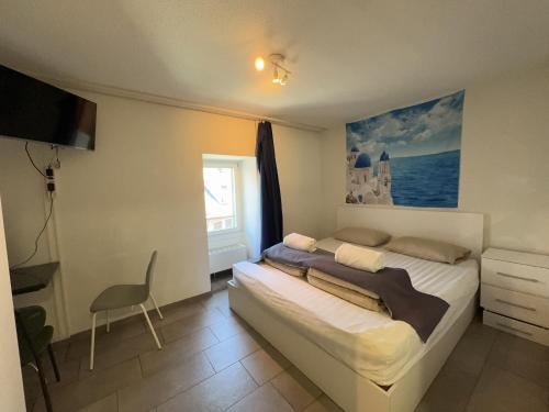 Postel nebo postele na pokoji v ubytování City Center Studio close to Zürich HB