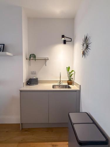 a kitchen with a sink and a counter top at City Nights, TV Bed, Free Parking, Nr Plymouth Hoe in Plymouth