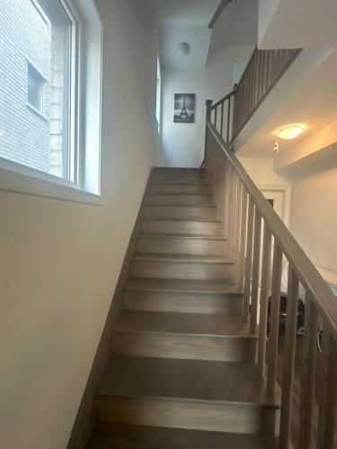 a staircase in a house with a window at Keppel Circle Residence in Brampton