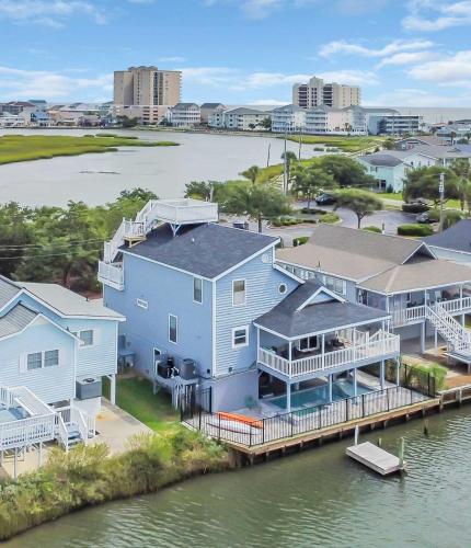 an aerial view of a house on the water at Captain's Cove - Pool Rooftop and Inlet Views in Myrtle Beach