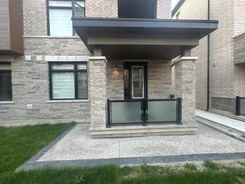 a house with a black fence in front of it at Keppel Circle Residence in Brampton