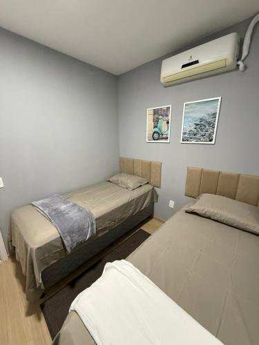 Postel nebo postele na pokoji v ubytování Apartamento vista para o rio ao lado do shopping