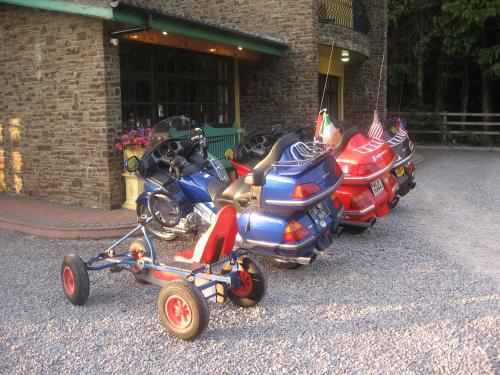 a group of motorcycles parked next to a building at 19th Green Guesthouse in Killarney