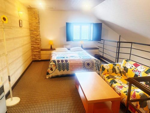 Postel nebo postele na pokoji v ubytování 伊香保の星空