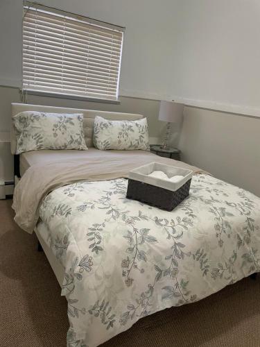 a bedroom with a bed with a box on it at 3 Bed - Best View in Town! in Surrey
