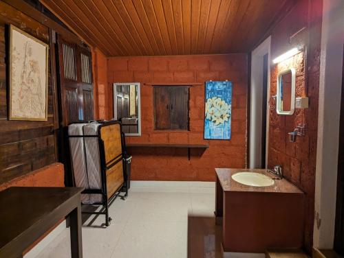 a bathroom with a sink and a counter top at Aranya a wild forest ecostay in Kalasa
