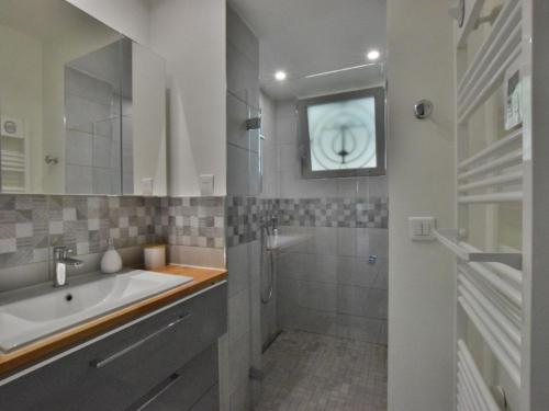 a bathroom with a tub and a sink and a shower at Maison rénovée, confort moderne, quartier calme, parking - FR-1-498-120 in Thonon-les-Bains