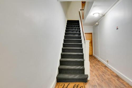 a staircase in a building with a stair case at Cozy Condo Jersey City in Jersey City