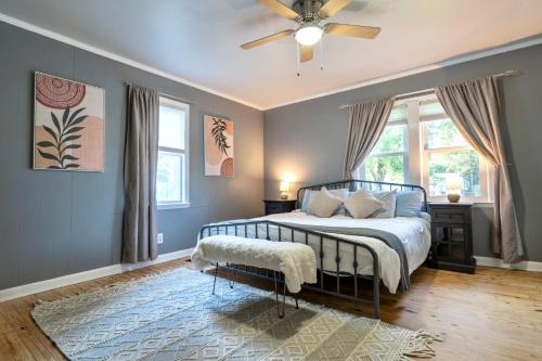 a bedroom with a bed and a ceiling fan at Fern Landing - Peaceful, spacious, modern, firepit in Chattanooga