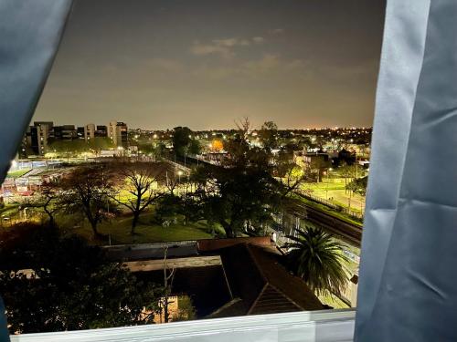 a view of a city from a window at 4-Espectacular departamento centrico in Morón