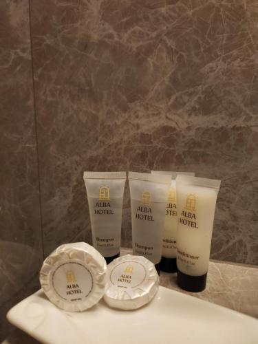 a group of four products sitting on top of a counter at Hotel Alba in Ica
