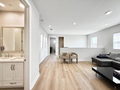 a living room with a couch and a table at #Marbella Lane - Spacious 4BR Modern Family Home! in Placentia