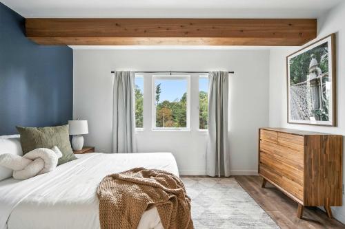 a bedroom with a white bed and a window at The Adelynn 5BR - Sleek - Spacious - Walkable in Portland