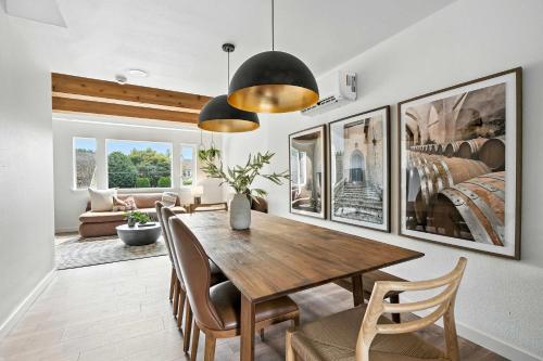 a dining room with a wooden table and chairs at The Adelynn 5BR - Sleek - Spacious - Walkable in Portland