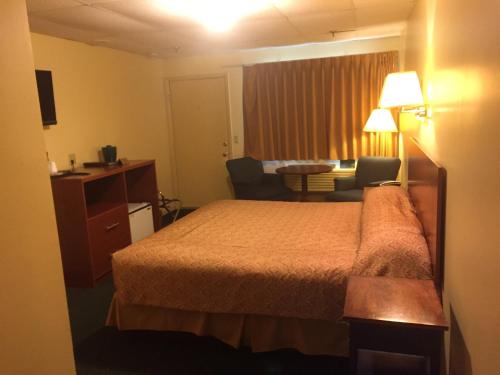Un ou plusieurs lits dans un hébergement de l'établissement Briarcliff Motel