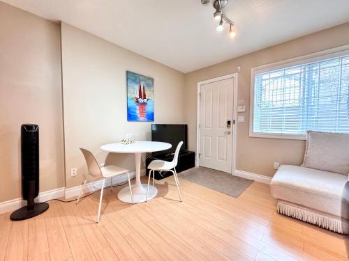 a living room with a table and a couch at Cozy 1bedroom Suite in Vancouver Westside in Vancouver