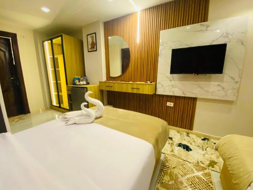 Télévision ou salle de divertissement dans l'établissement Rehana Pyramids Hotel