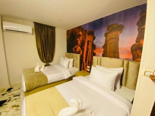 Un ou plusieurs lits dans un hébergement de l'établissement Rehana Pyramids Hotel