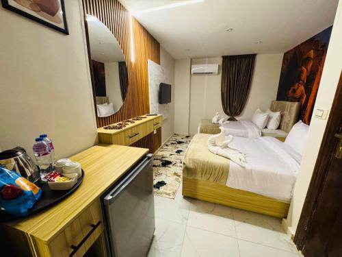 Un ou plusieurs lits dans un hébergement de l'établissement Rehana Pyramids Hotel