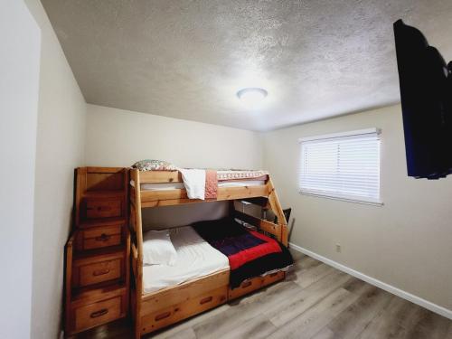 a bedroom with two bunk beds and a window at Complete Home with everything in The Colony