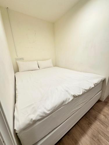 Ein Bett oder Betten in einem Zimmer der Unterkunft Meworld Hotel - Daan