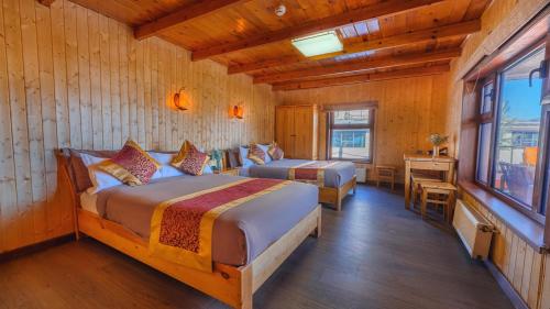 Postel nebo postele na pokoji v ubytování Resort World Terelj