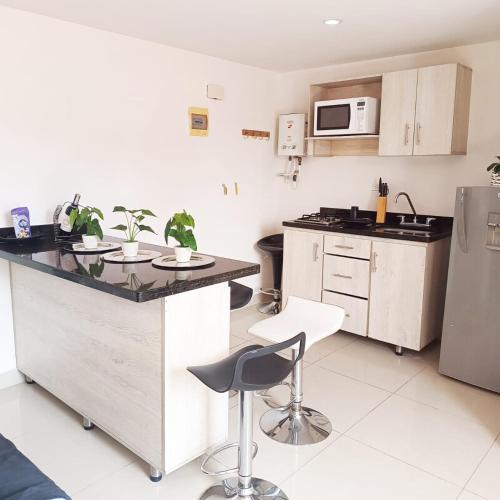 Kuchyň nebo kuchyňský kout v ubytování MedalloHost ApartaSuite Poblado 207 -809